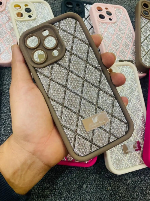 Glittery silver and brown protective phone case with a quilted pattern design.