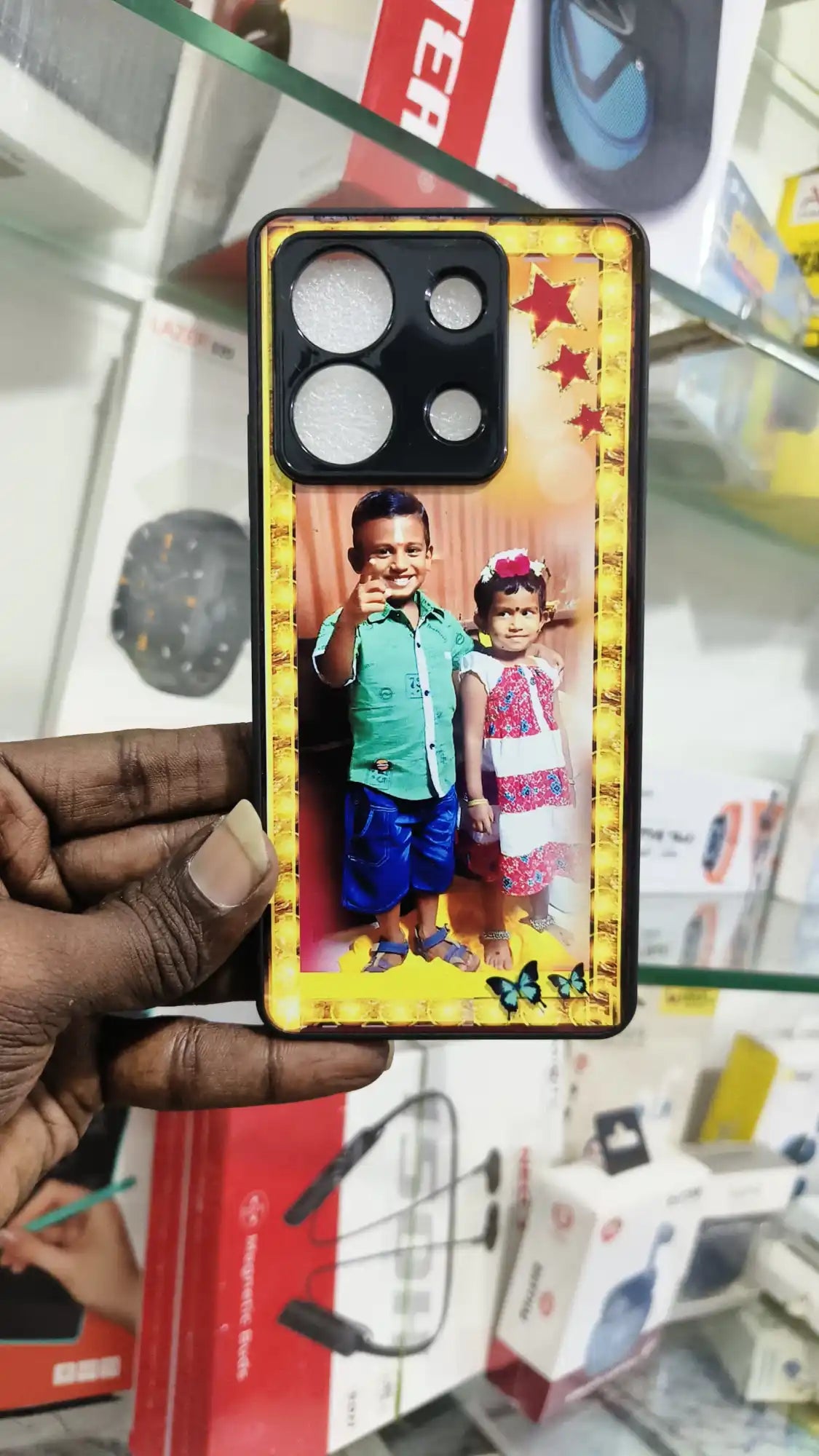 Phone case with a decorative photo display and camera cutouts for an iPhone.